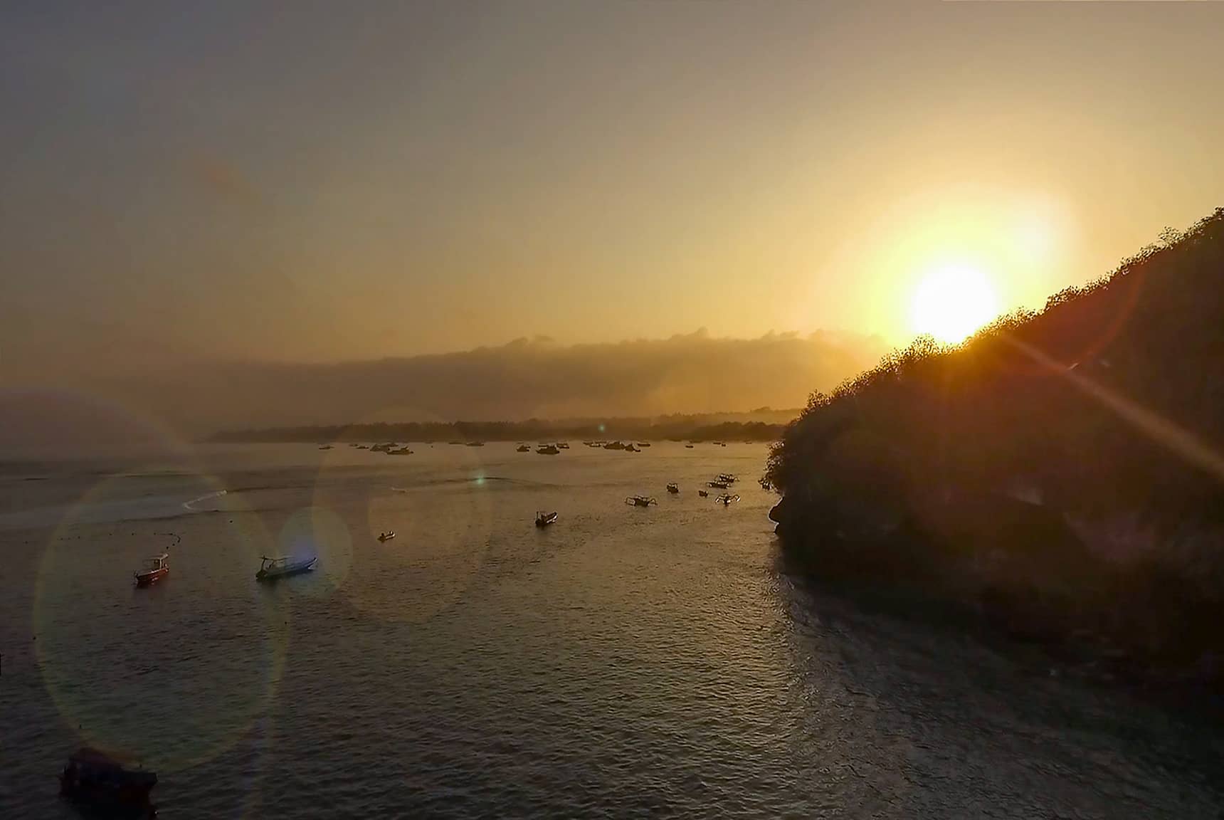 Sunrise over Nusa Lembongan and the harbor