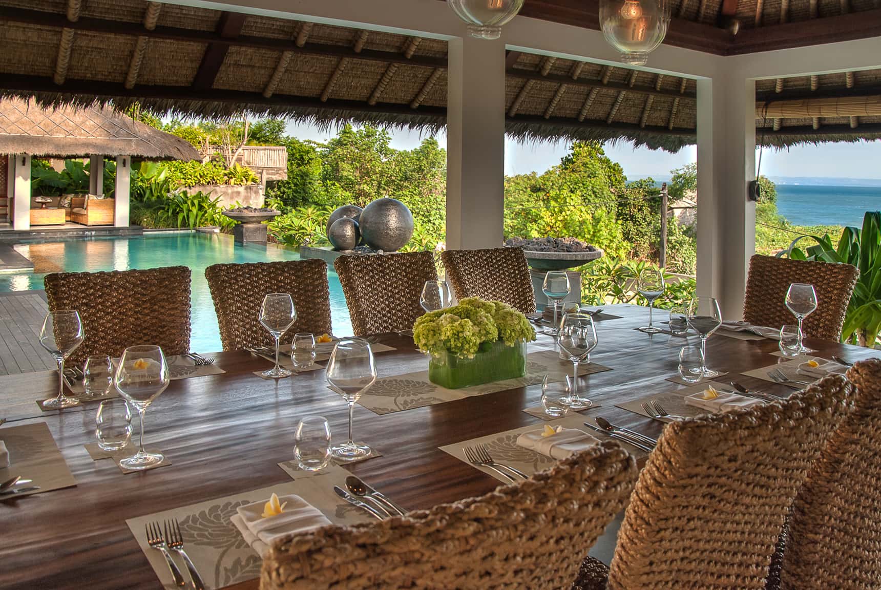 Editing digital photography of luxury hotels, resorts and villas by LuxViz: Seseh Beach Villas - covered exterior dining area with pool and ocean views